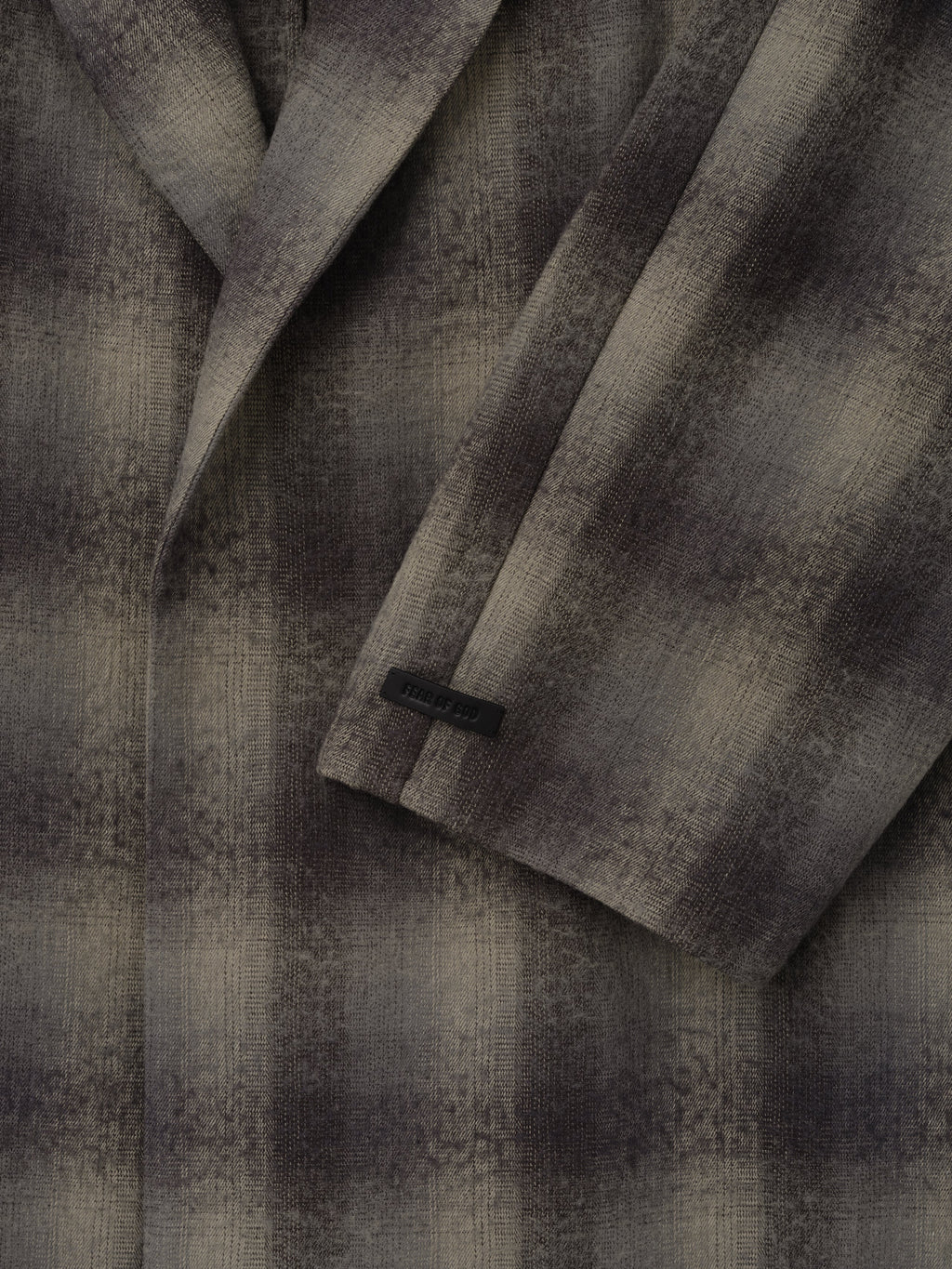 Cotton Wool Flannel Robe in gray and black plaid shown in close detail with textured wool fabric overlapping front panels and a long sleeve cuff as Outerwear