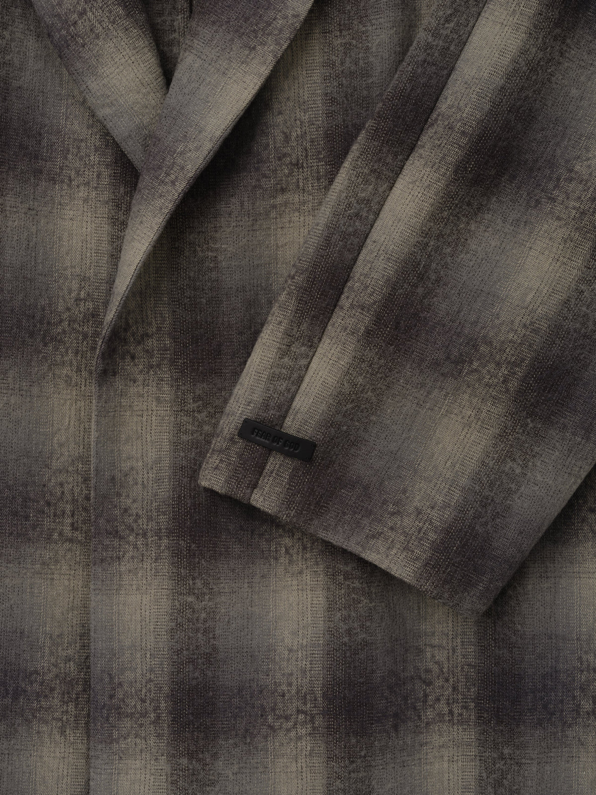Cotton Wool Flannel Robe in gray and black plaid shown in close detail with textured wool fabric overlapping front panels and a long sleeve cuff as Outerwear