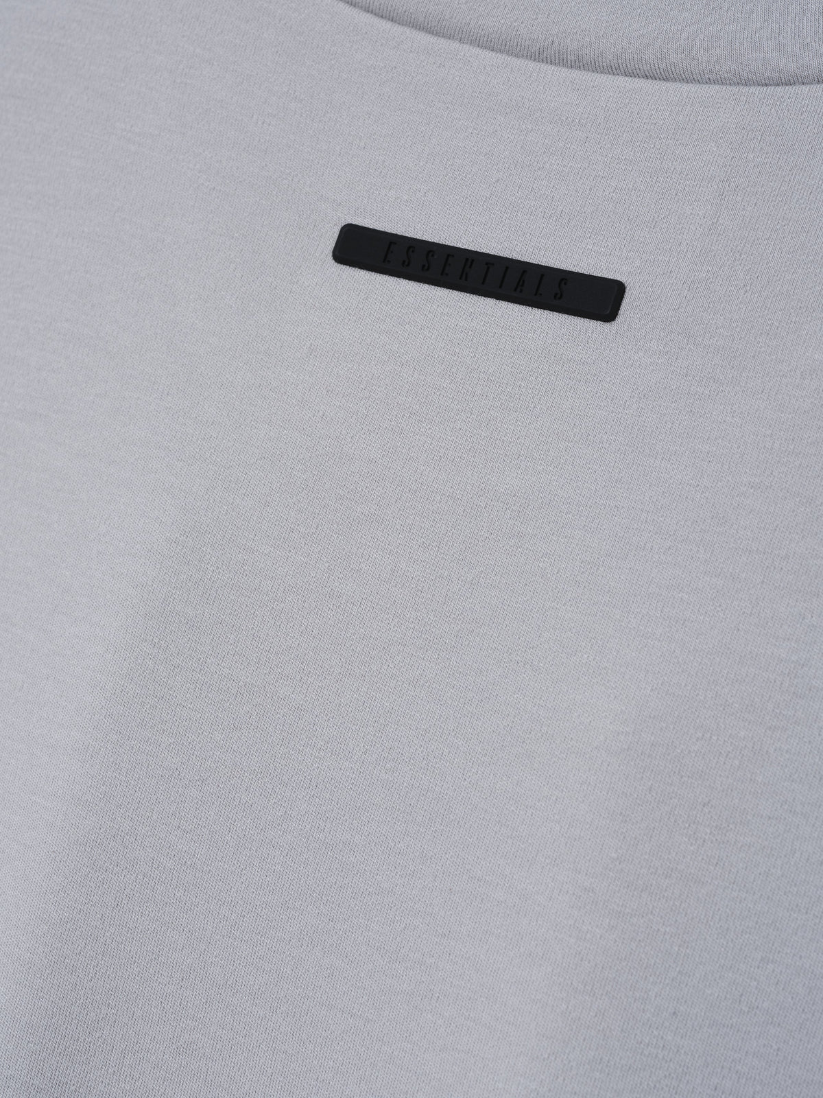 Womens Longsleeve V-Neck in light grey close up showing tonal chest branding and soft fabric texture as Tops
