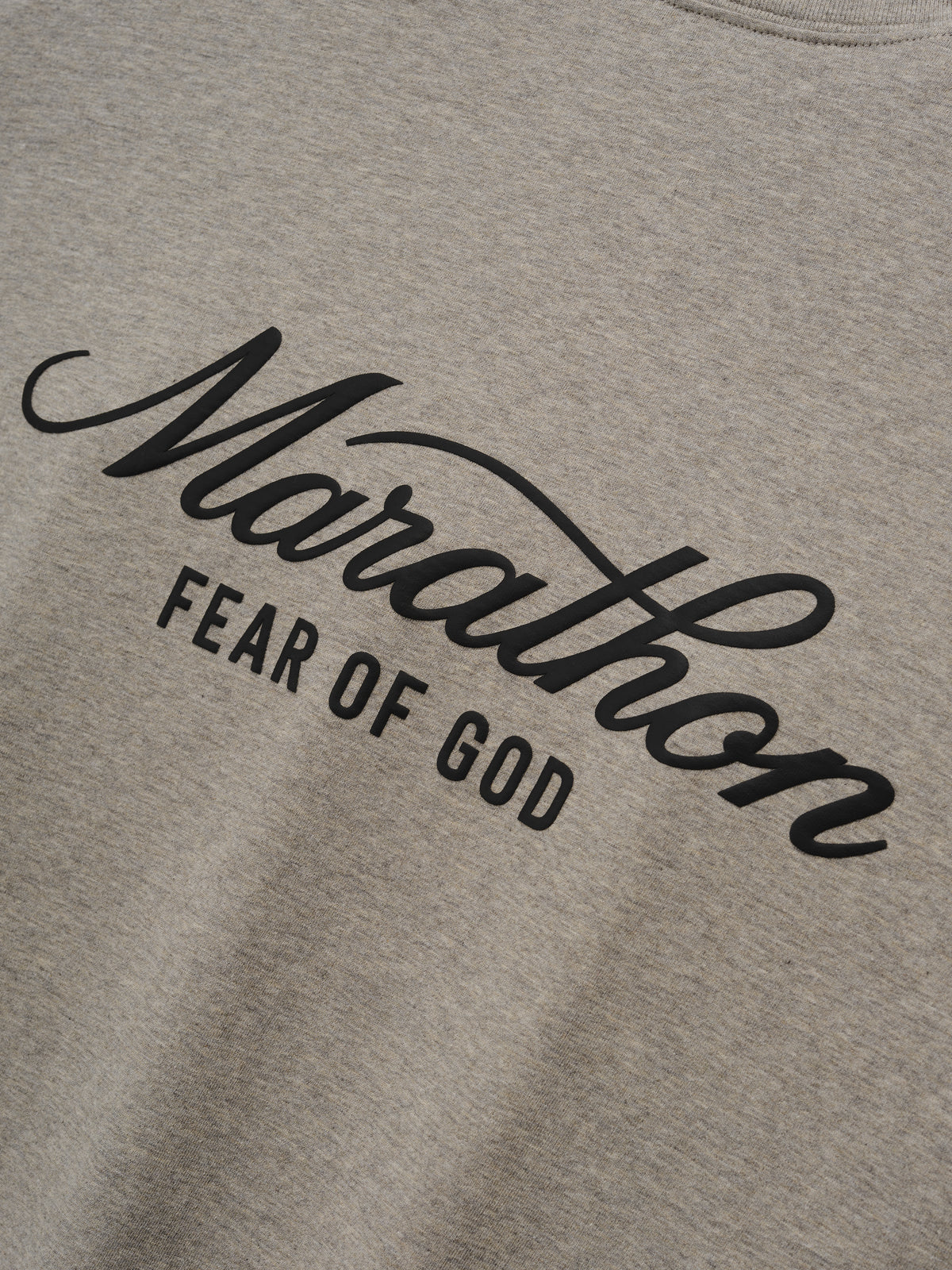Marathon Merch Tee in heather gray featuring bold black Marathon Fear of God script branding across the chest on soft jersey fabric as Tops