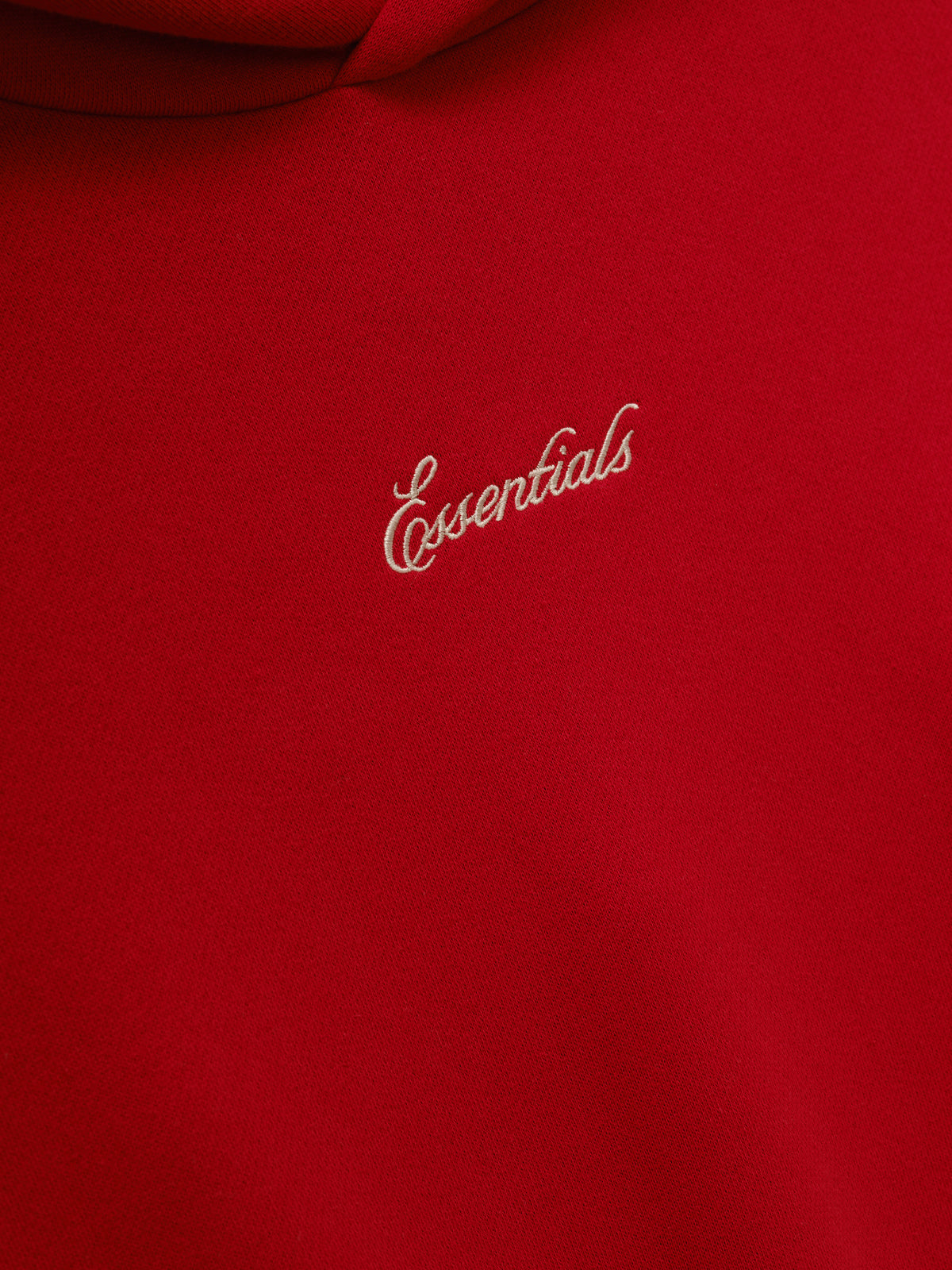 Marathon Merch Hoodie in red shown in close detail with tonal Essentials embroidery on soft fleece fabric as Tops