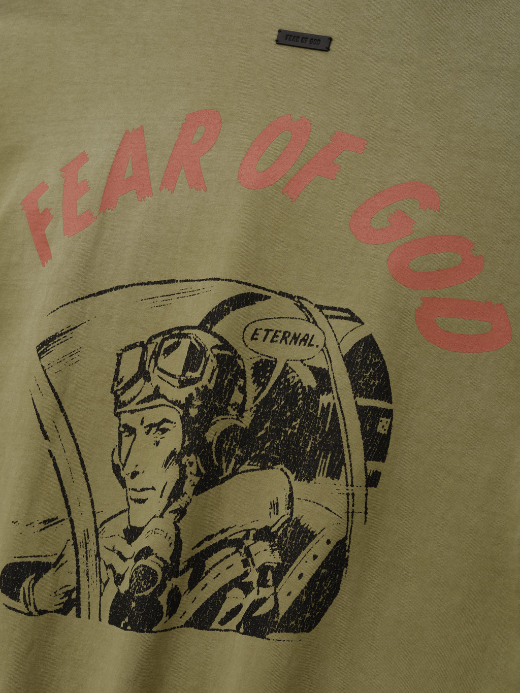 Flight Long Sleeve Tee in olive green featuring red Fear of God lettering above a black vintage astronaut cockpit illustration as Tops
