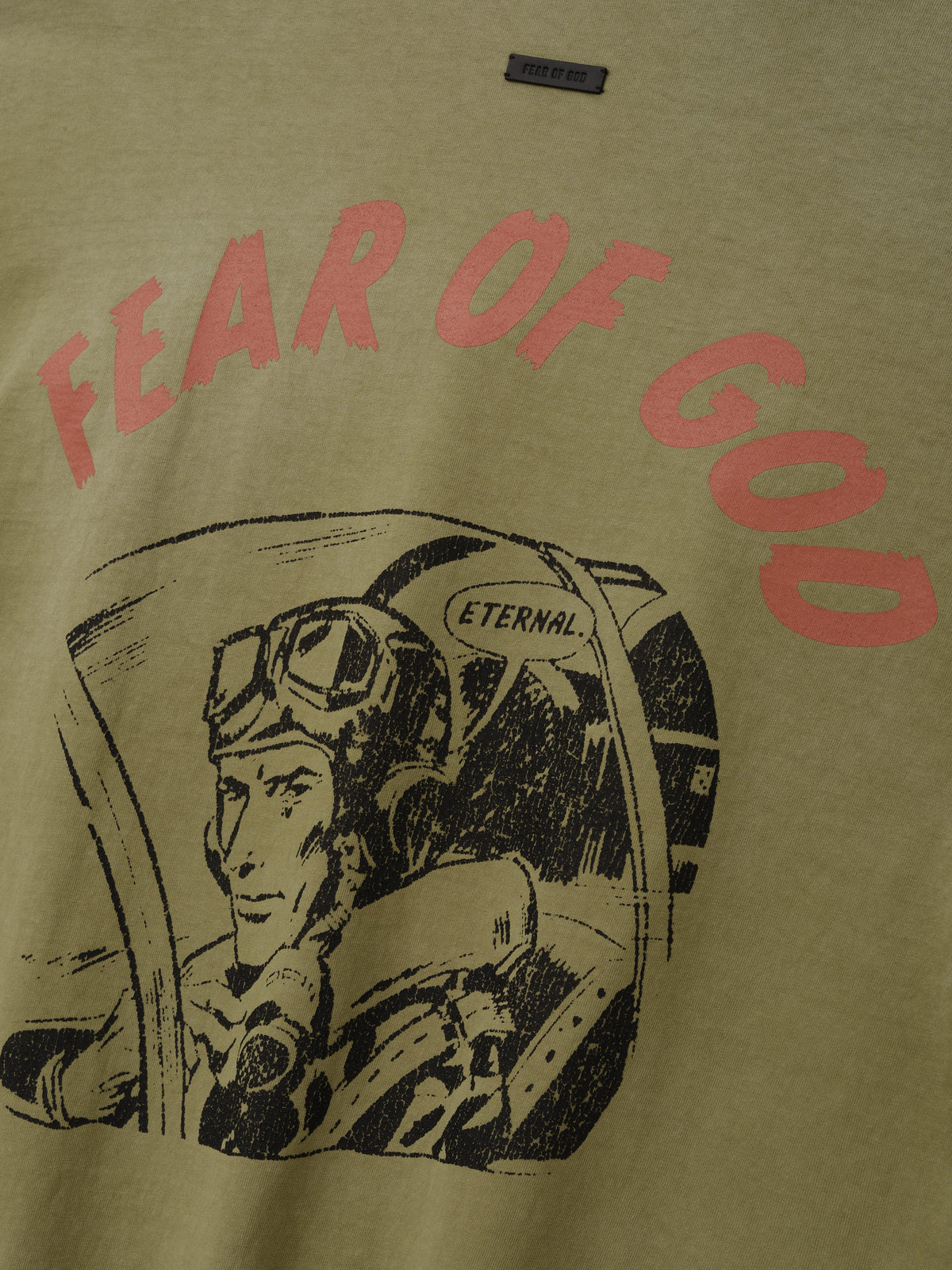Flight Long Sleeve Tee in olive green featuring red Fear of God lettering above a black vintage astronaut cockpit illustration as Tops