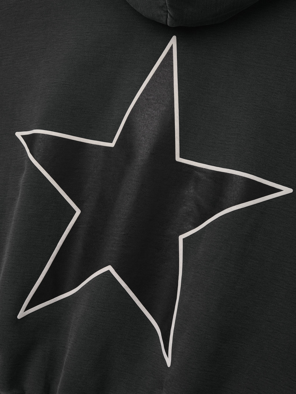 Reflection Eternal Hoodie in black shown in close detail with a large outlined star graphic across the back and soft hooded design as Tops