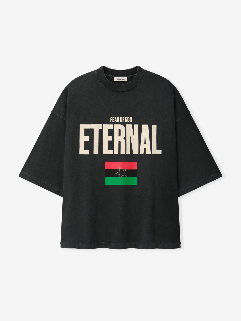Reflection Eternal Tee in black with cream Eternal lettering Fear of God branding and red green flag graphic with star shown from the front as Tops