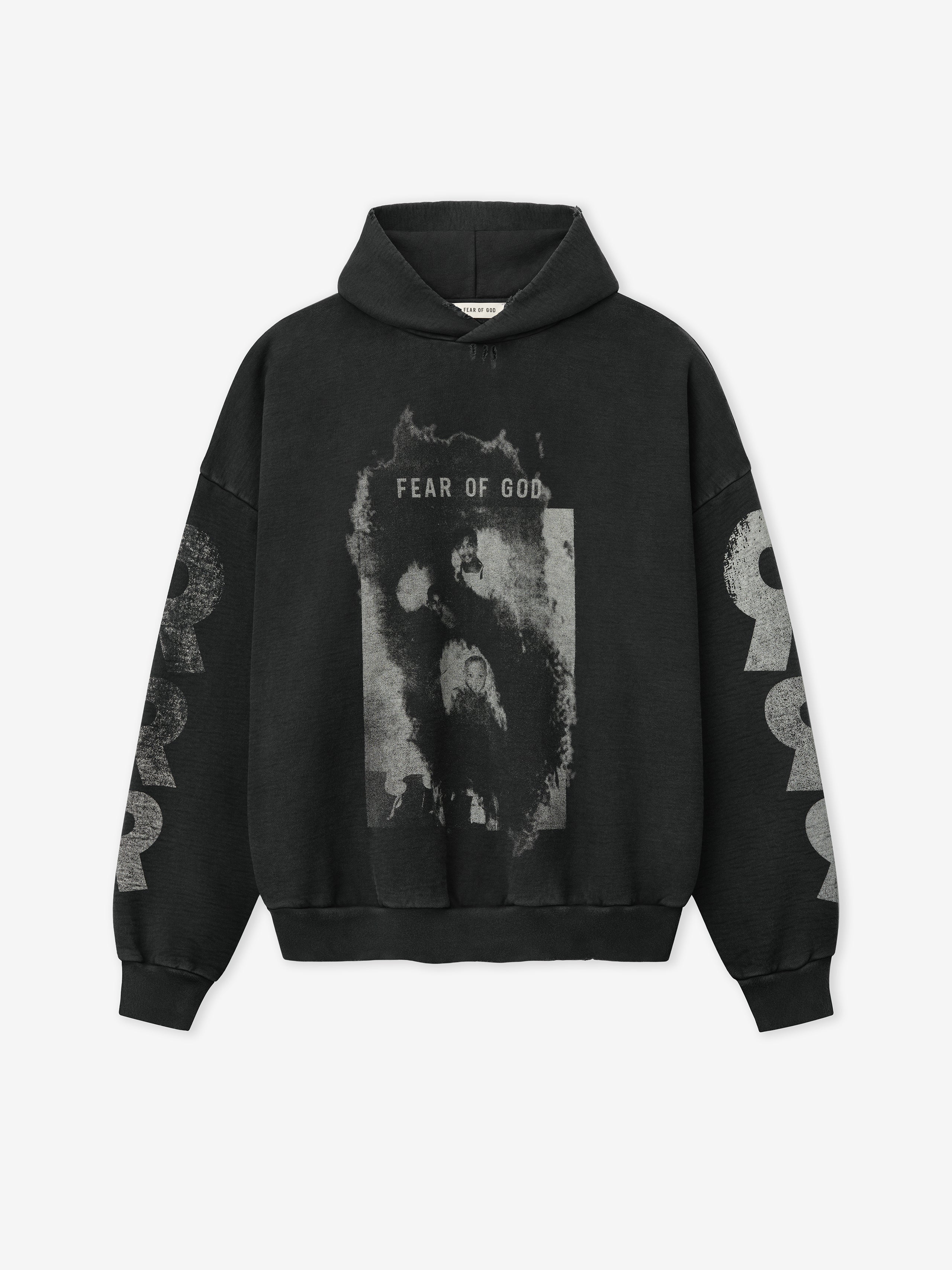 black cotton fleece hoodie with distressed grayscale graphic and Fear of God text on chest and bold print on sleeves
