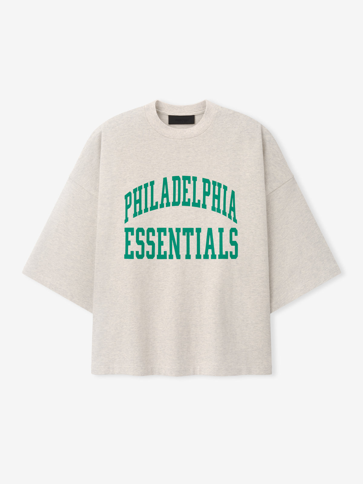 Eagles Merch Tee cream short sleeve T shirt with green Philadelphia Essentials collegiate lettering displayed against a light background in a clean Tops product view