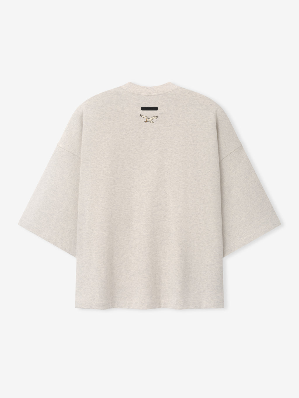 Eagles Merch Tee cream short sleeve T shirt with a small centered logo and relaxed silhouette displayed against a light background in a clean Tops product view