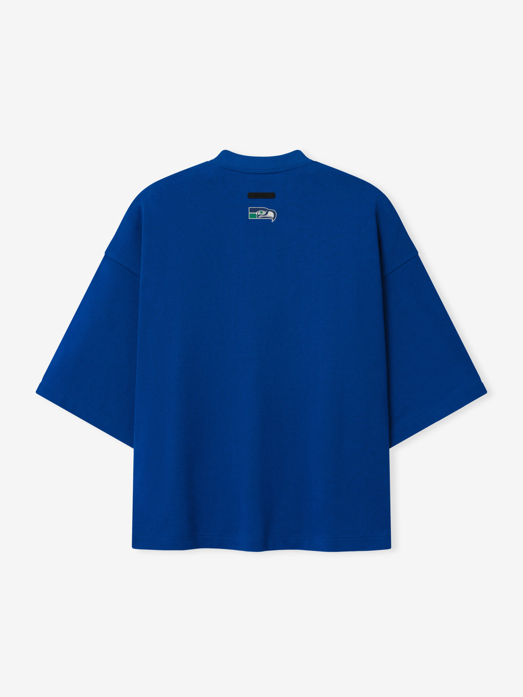 Seahawks Merch Tee blue oversized short sleeve shirt with a small neck label displayed against a light background in a clean Tops product view