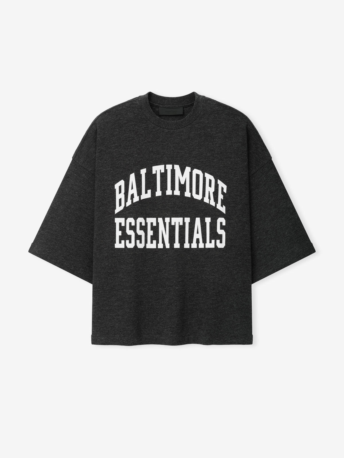 Ravens Merch Tee dark charcoal oversized shirt with bold white Baltimore Essentials collegiate lettering displayed against a light background in a clean Tops product view