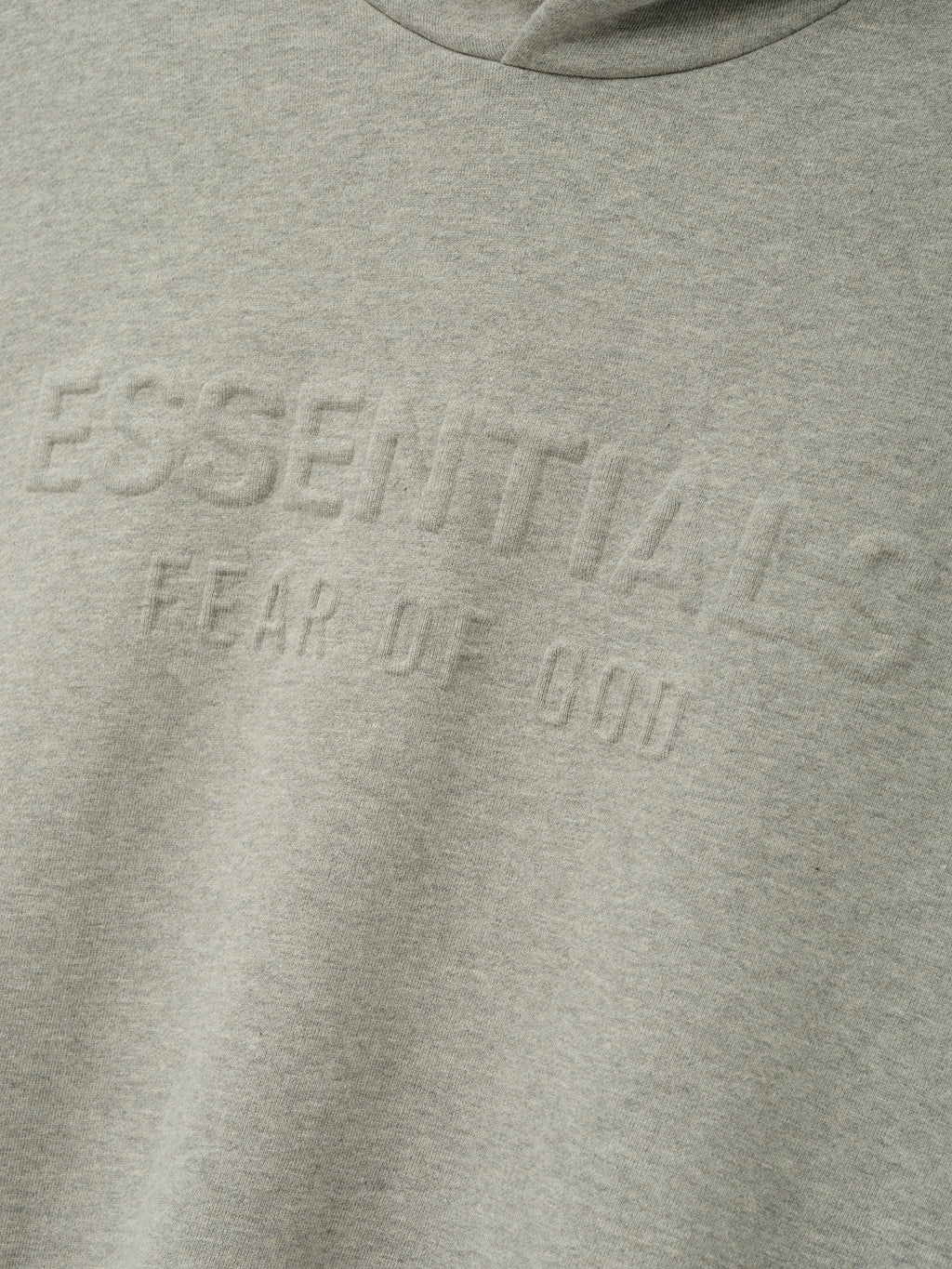 Embossed FW26 90s Relaxed Hoodie in gray with raised tonal chest lettering and a soft fleece texture visible across the front panel