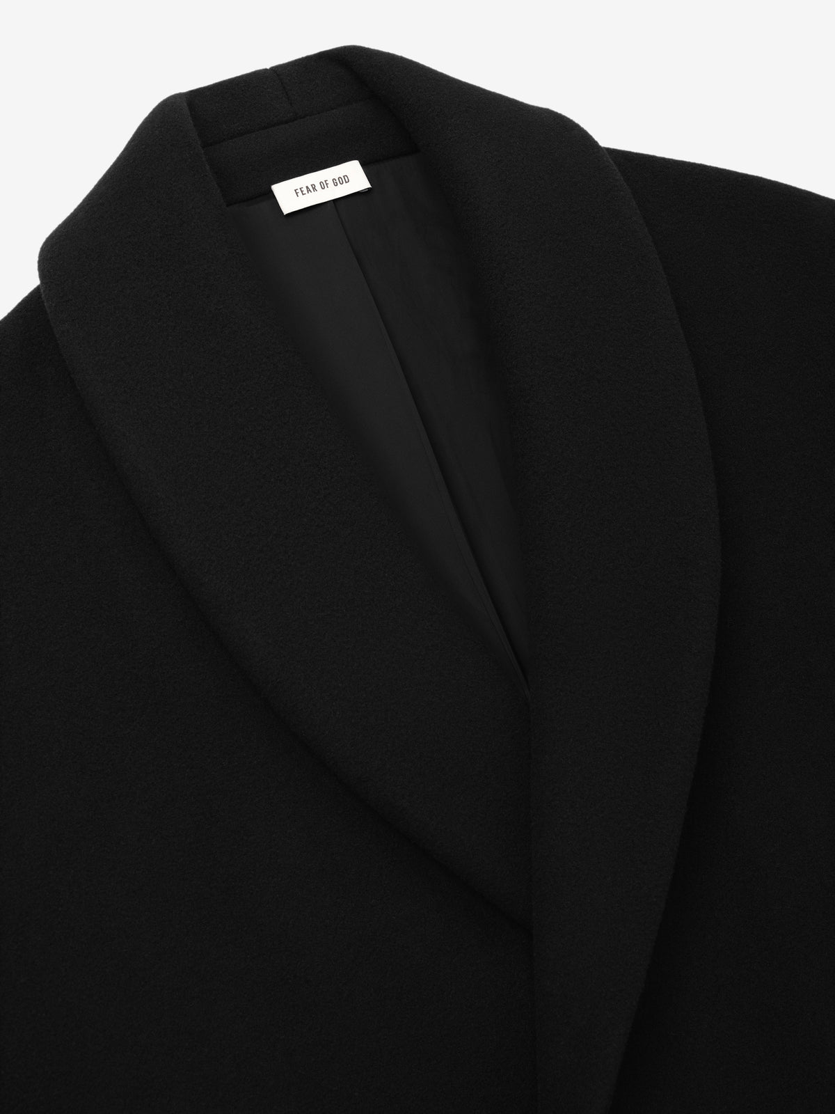 Melton Wool Shawl Overcoat in black closeup showing the broad shawl collar smooth wool texture and inner Fear of God label as Outerwear