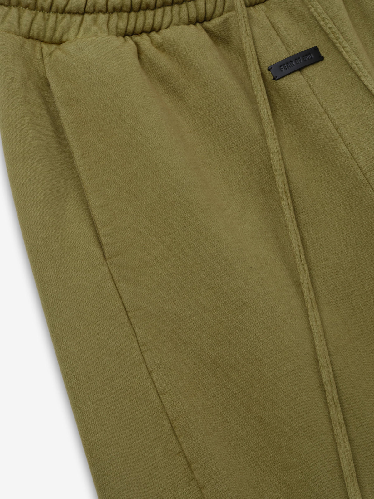 Engineered Sweatpants in olive green closeup showing elastic waistband stitched seam and branded label detail as Bottoms