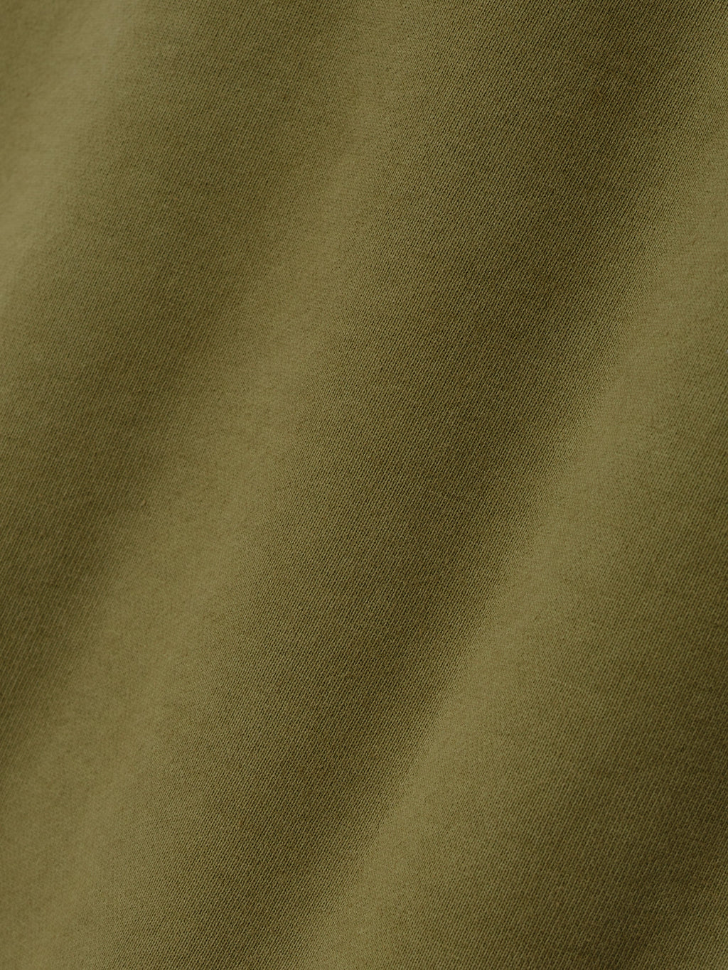 Engineered Sweatpants in olive green closeup highlighting the soft woven fabric texture and subtle tonal variation as Bottoms