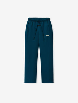 Womens Slim Trackpant in deep teal with an elastic waistband adjustable drawstrings slim straight legs and a subtle Fear of God logo as Bottoms