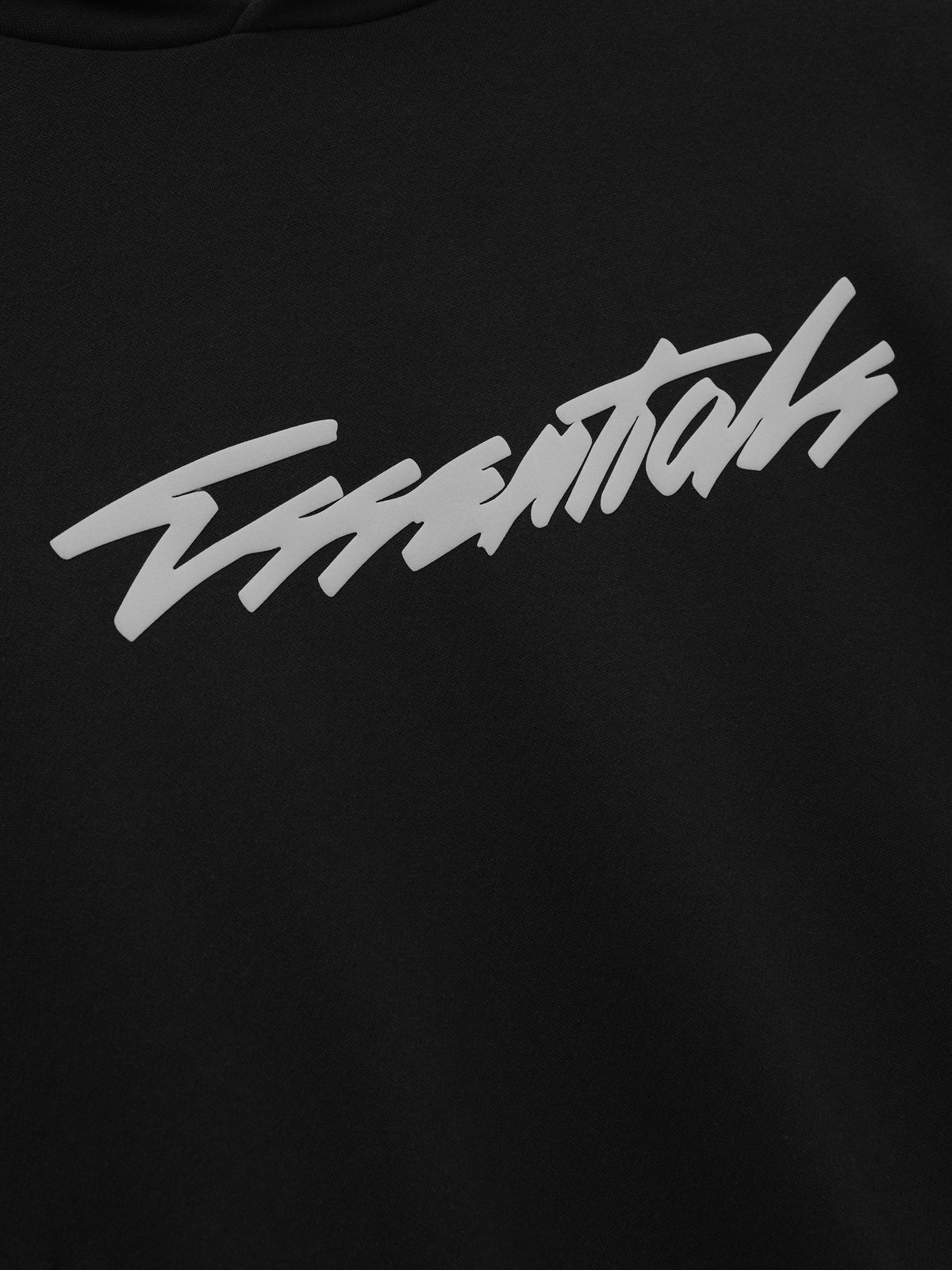 Kids Classic Raglan Hoodie in black with a white script chest graphic shown in close detail as Tops