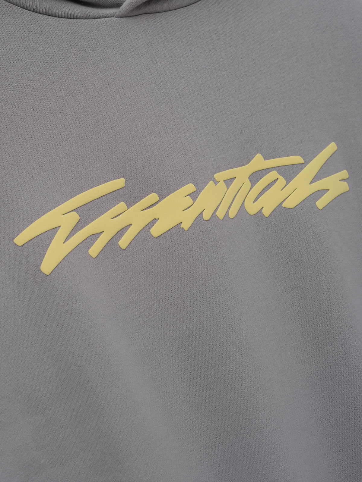 Kids Classic Raglan Hoodie in grey with a yellow script chest graphic and soft textured fabric shown in close detail as Tops