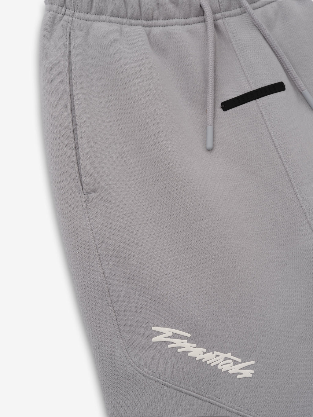 Kids Classic Moto Sweatpant in gray shown in close detail with a drawstring waist side pocket black zipper and white lower leg logo as Bottoms