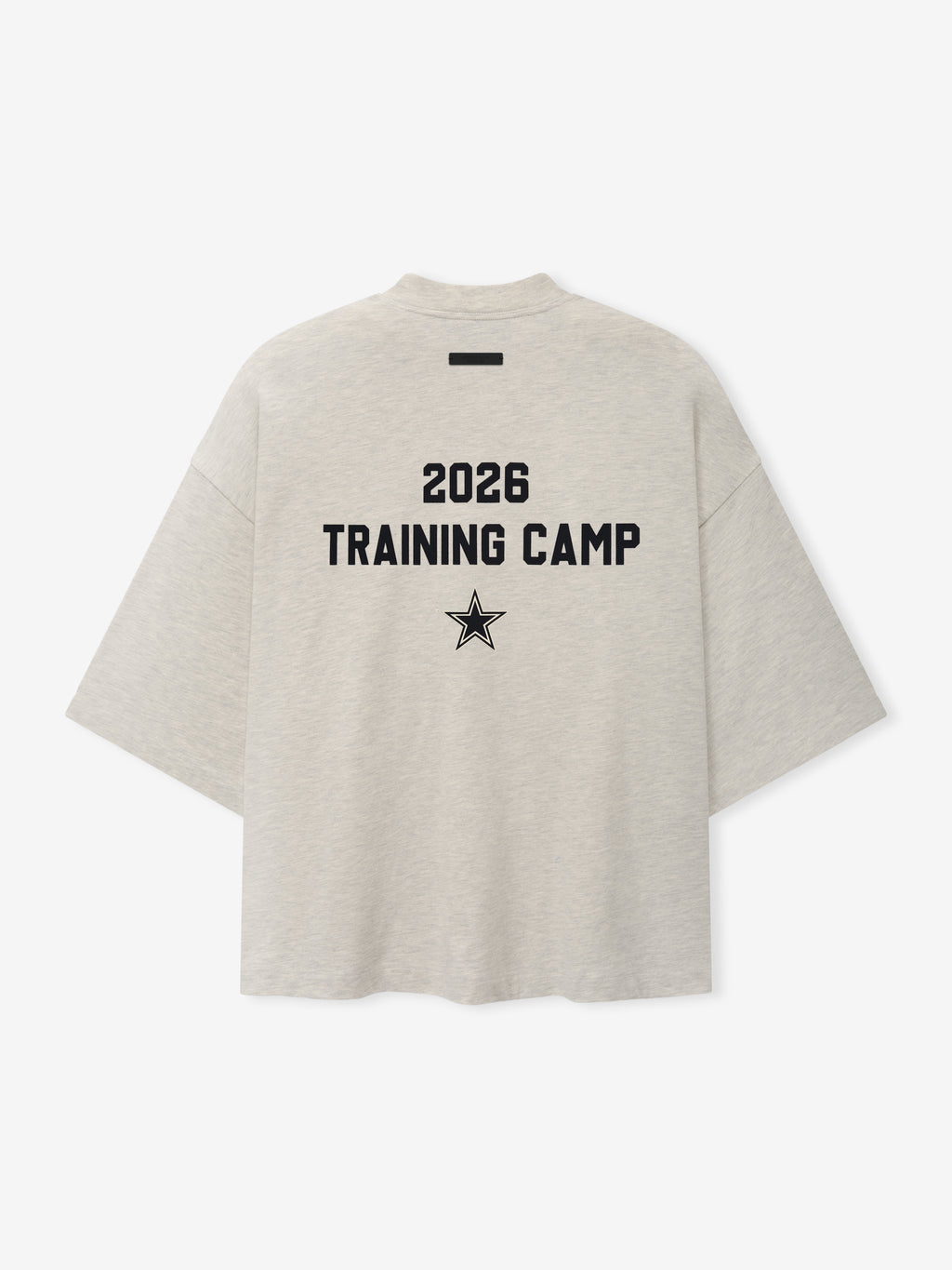 Dallas Cowboys Training Camp Tee in light heather fabric with a boxy fit and dropped shoulders, featuring bold black "2026 Training Camp" text and star graphic on the back.