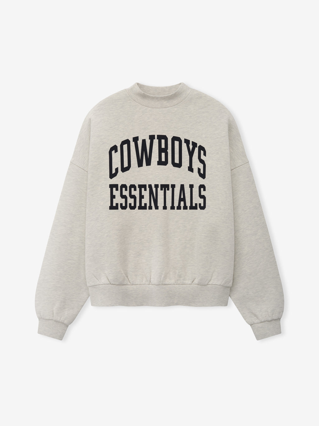 Dallas Cowboys Training Camp Crewneck Boxy Fit in light heather fabric featuring a relaxed silhouette with dropped shoulders and bold black collegiate-style "Cowboys Essentials" text across the chest.