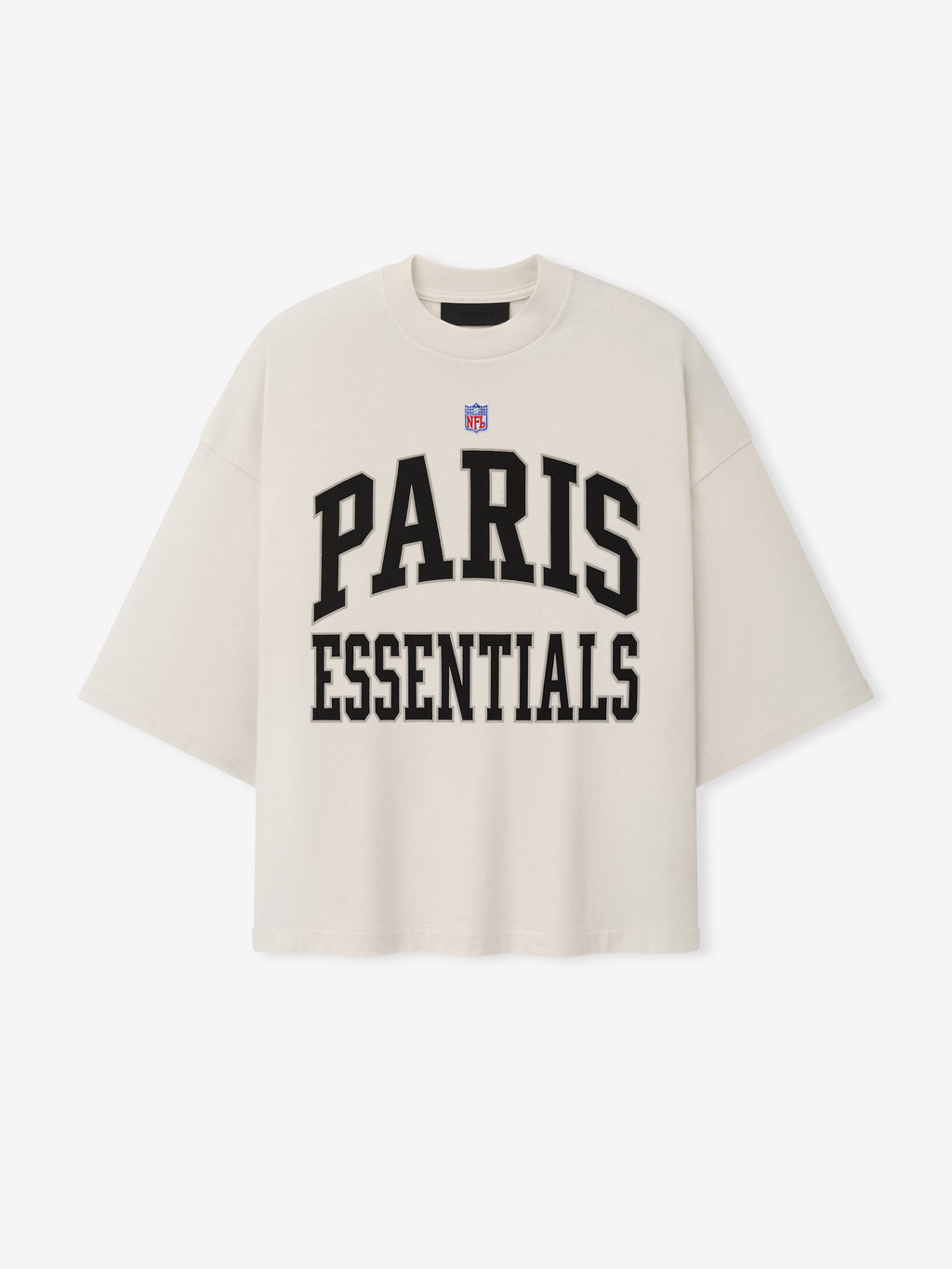 NFL Paris Merch Tee in off white with short sleeves NFL shield and bold black PARIS ESSENTIALS graphic lettering displayed against a plain background Tops