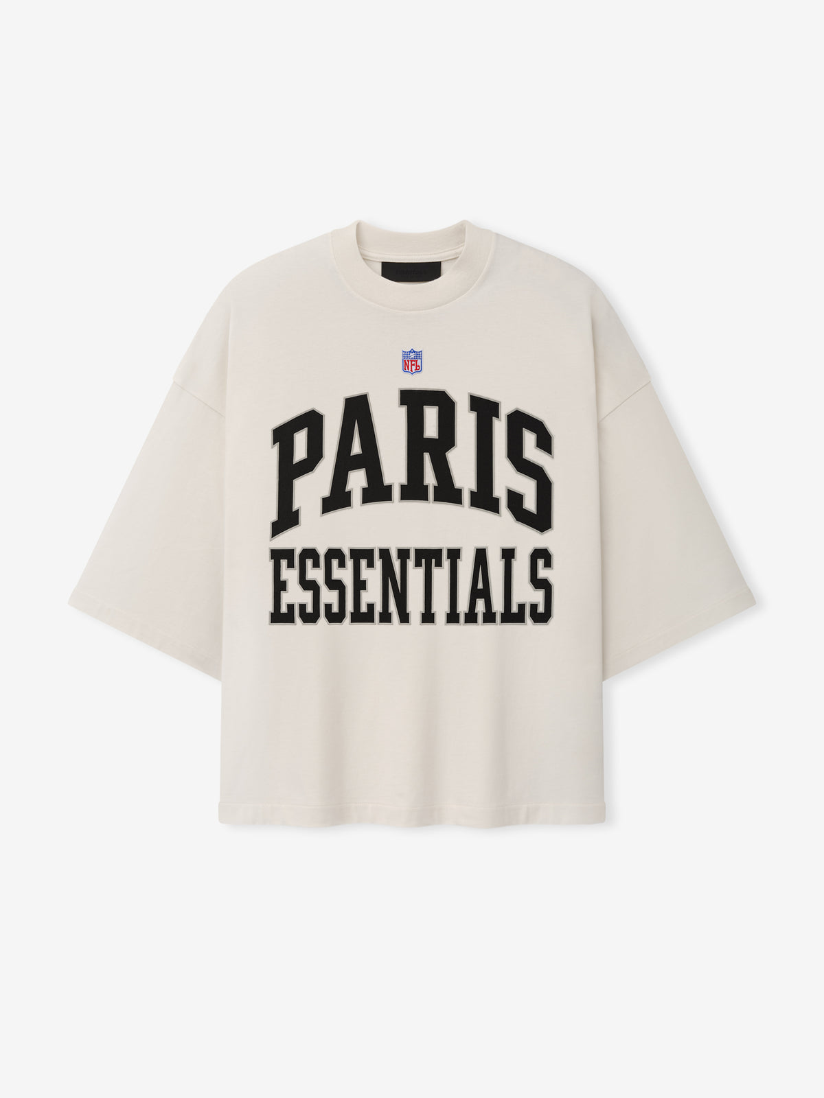 NFL Paris Merch Tee in off white with short sleeves NFL shield and bold black PARIS ESSENTIALS graphic lettering displayed against a plain background Tops