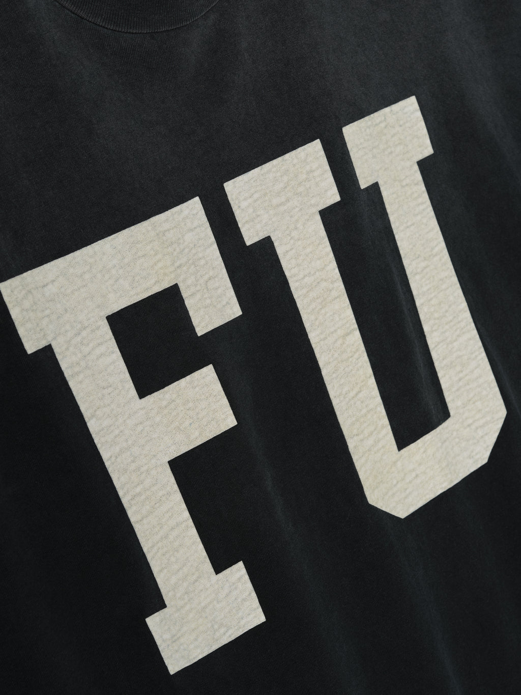 Freedom Relaxed Long Sleeve Tee in black with large textured cream “FU” letters on the front, crafted from soft cotton for a comfortable and casual tops choice.