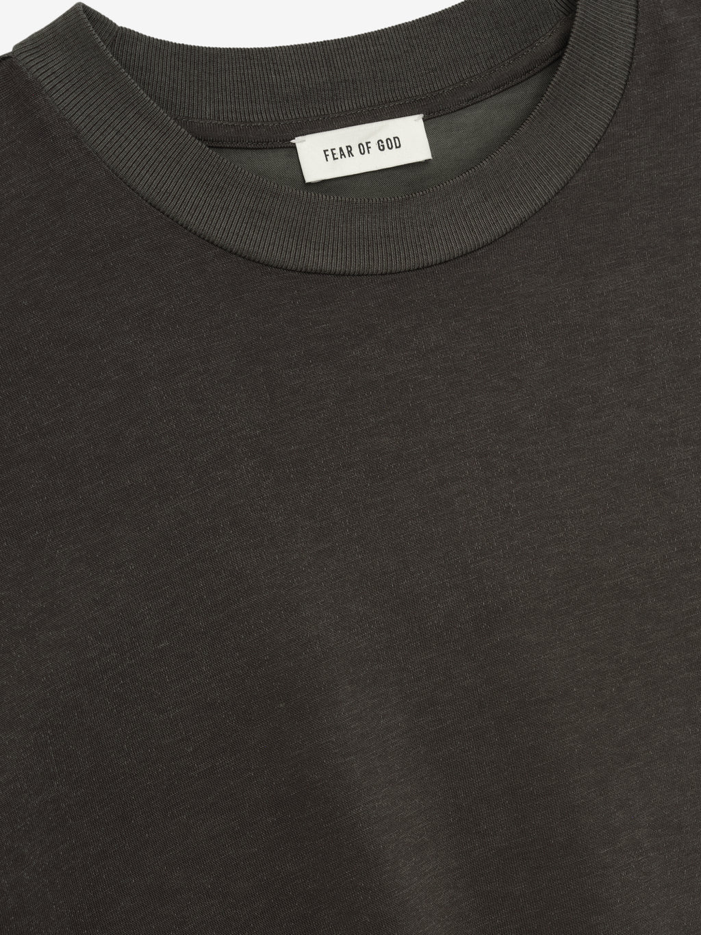 Close-up view of an off-black Cotton Viscose Relaxed Tee showing fine fabric texture and a ribbed crew neckline with an inner label against a plain background.