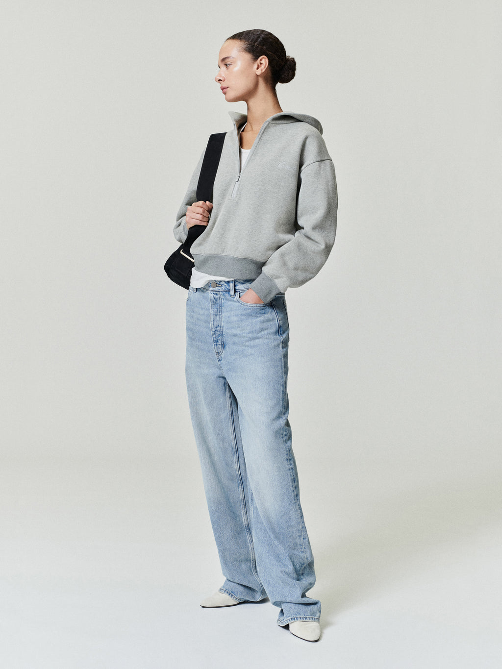 woman wearing vintage wash light blue straight leg denim jeans with relaxed boyfriend-inspired fit and low rise