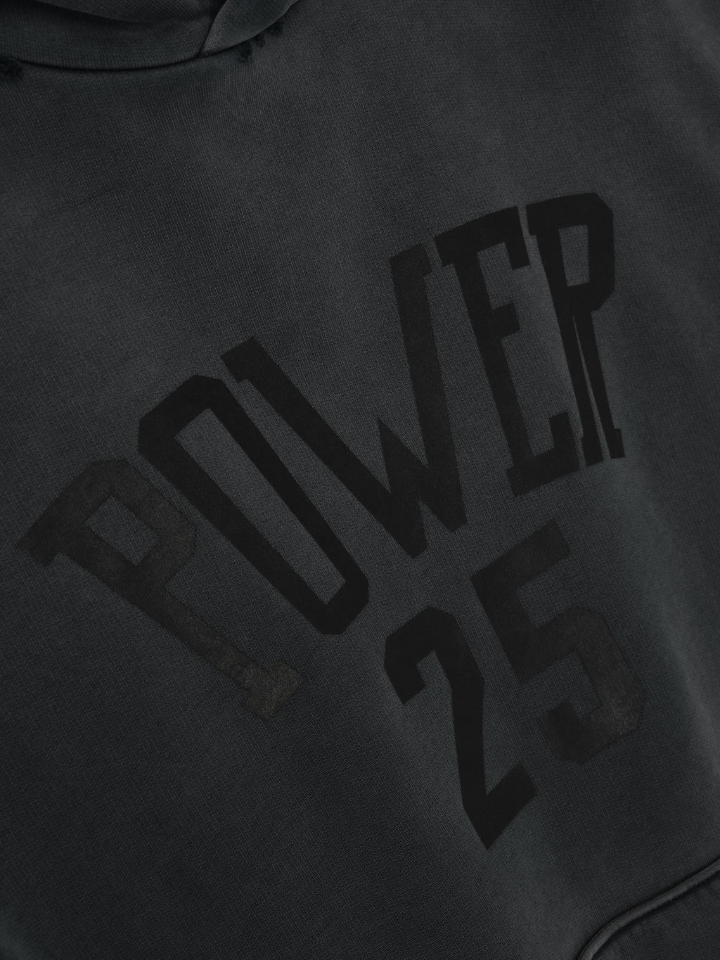 Vintage Power 25 Hoodie in washed black featuring raised black lettering spelling "POWER 25" across the chest, crafted from soft fabric for casual outerwear.