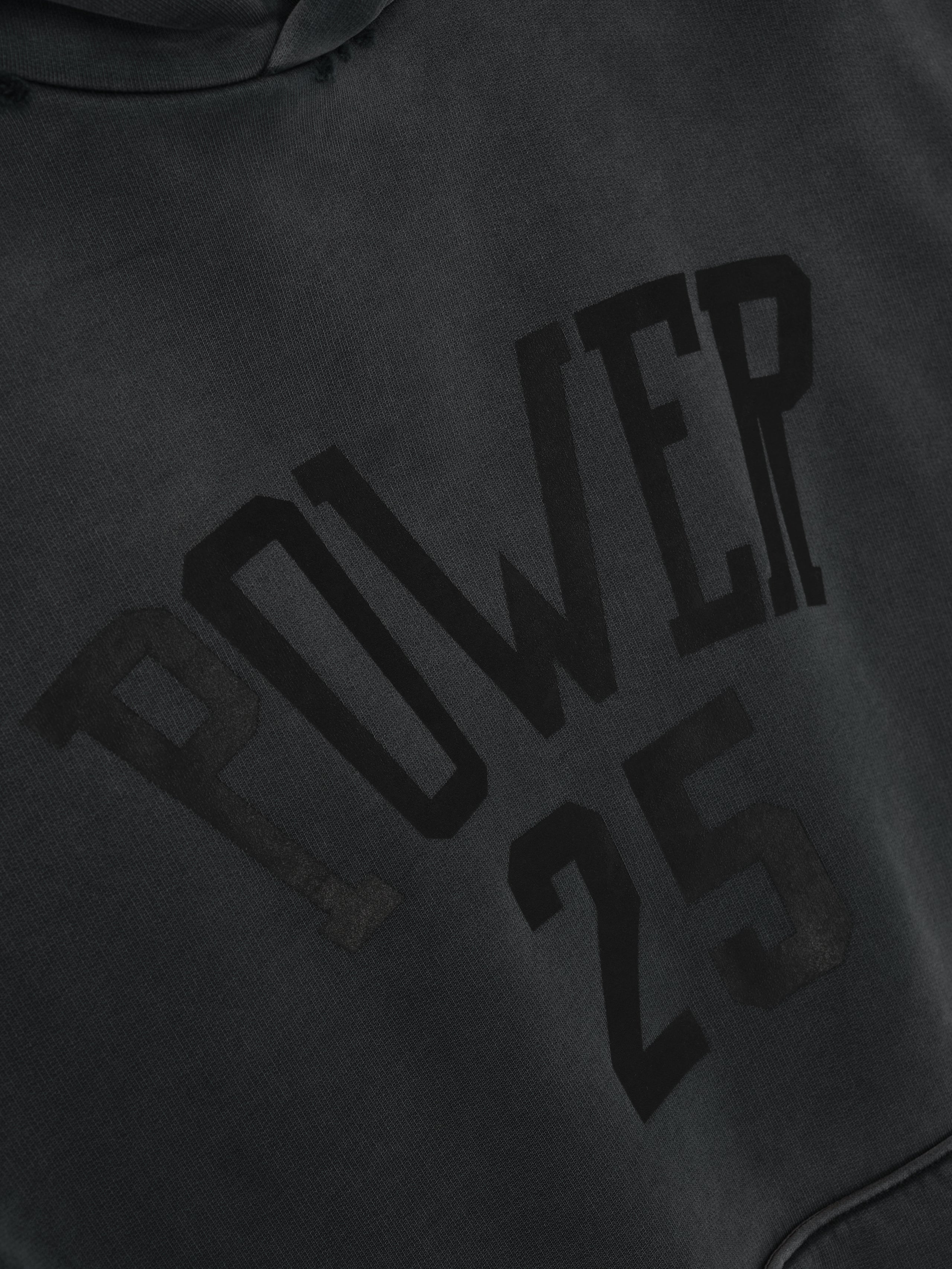 Vintage Power 25 Hoodie in washed black featuring raised black lettering spelling "POWER 25" across the chest, crafted from soft fabric for casual outerwear.